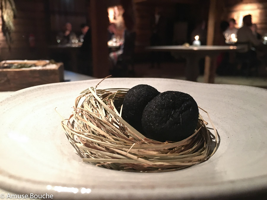 egg coated in ash, sauce made from dried trout and pickled marigold at Faviken